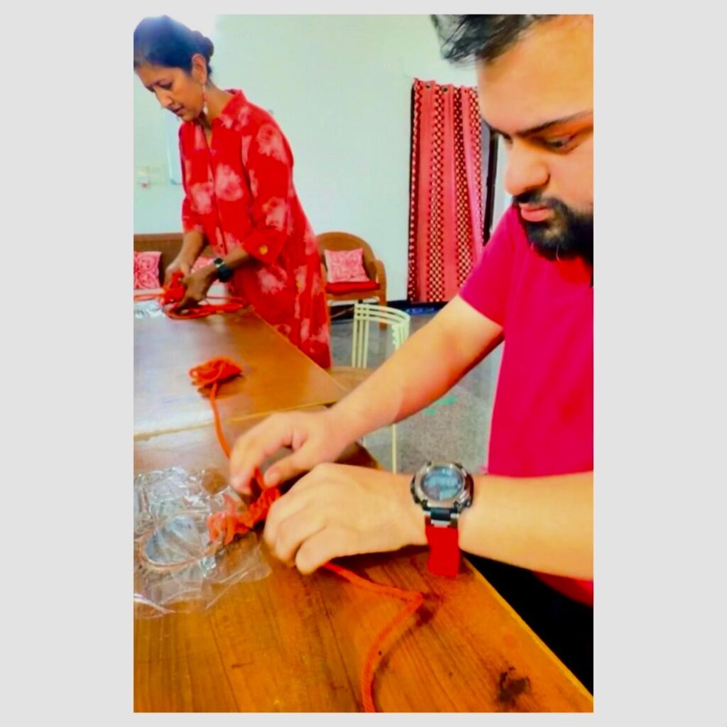 Students working on a craft product together